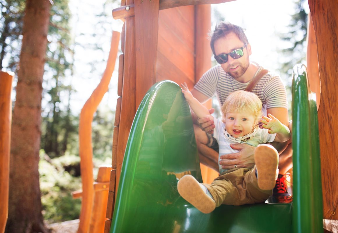 father-with-little-boy-on-the-playground-PNTWDZQ-1161x800